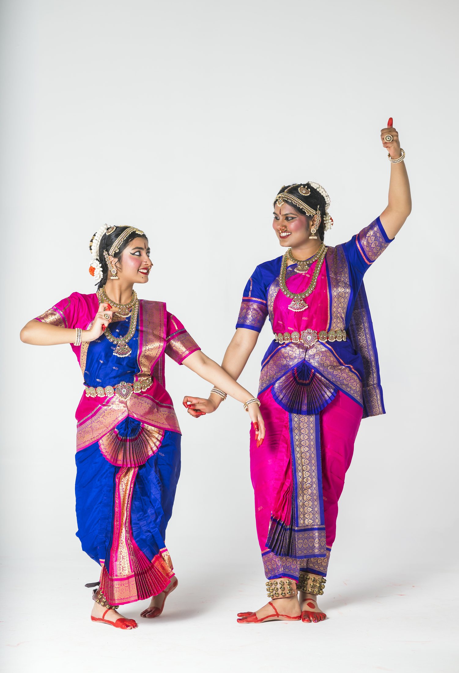Aadhya and Thanvi in blue and pink costumes