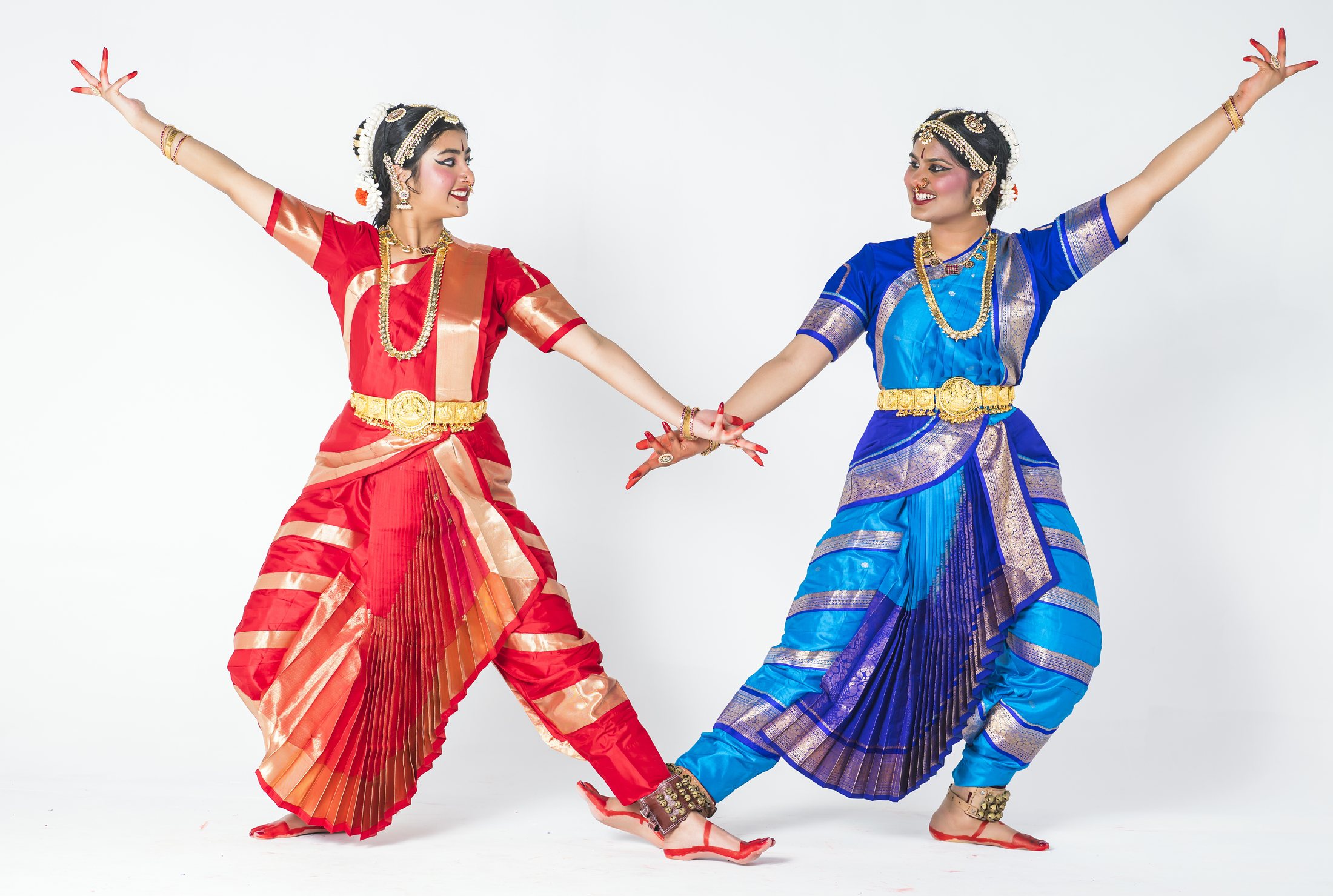 Aadhya and Thanvi in red and blue costumes