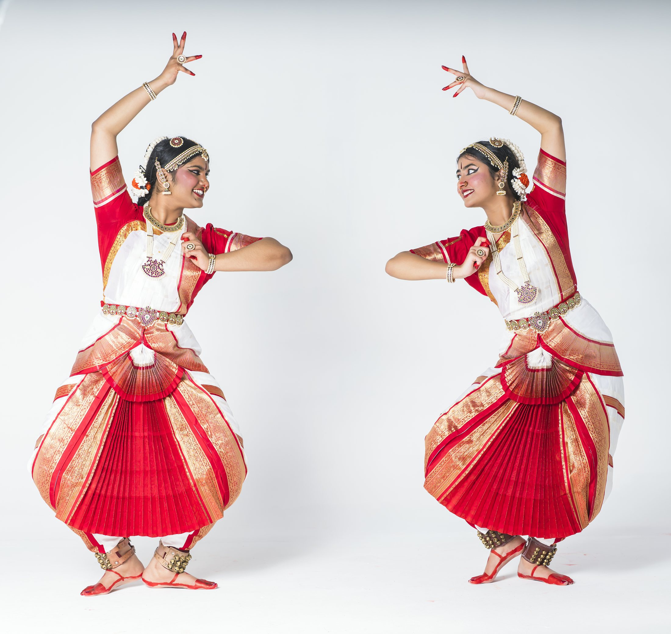 Aadhya and Thanvi in red and white costumes